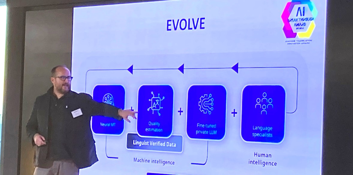 Man standing in front of PowerPoint slide