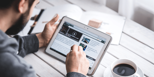 Man browsing on a tablet